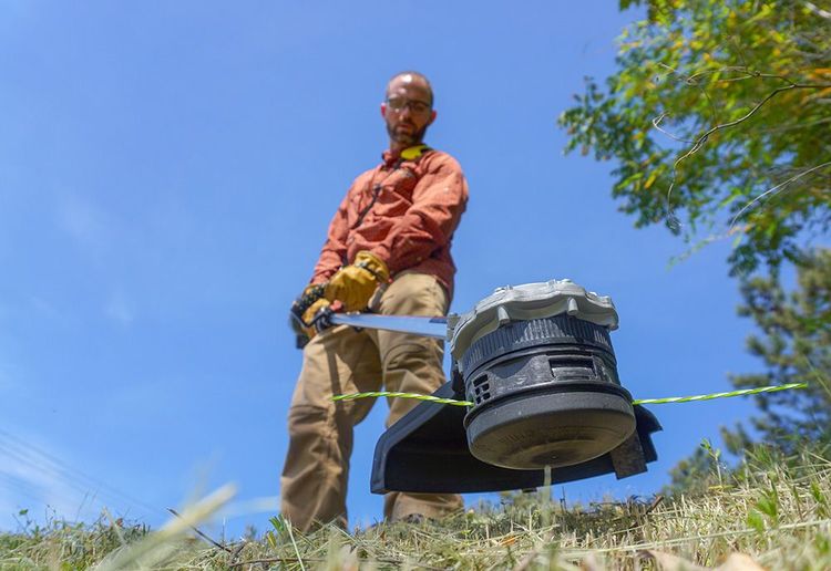 Man with weed wacker